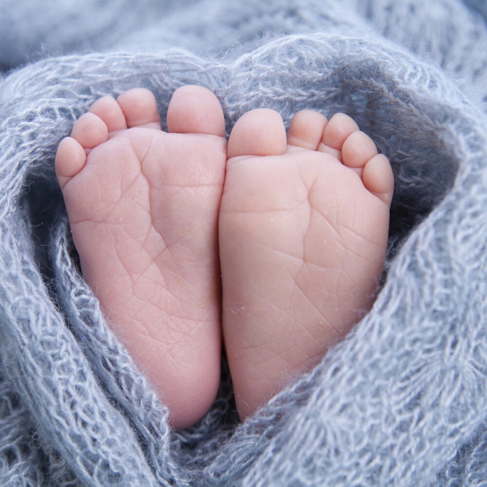 tiny foot of newborn baby